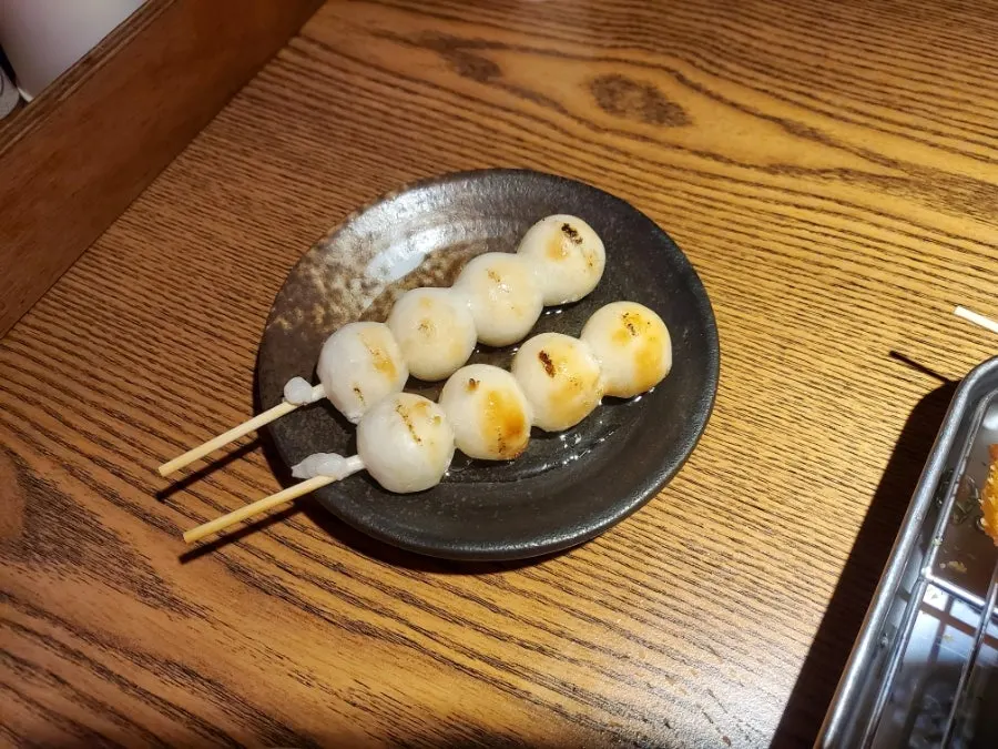 A plate of skirt steak skewer and heart skewer