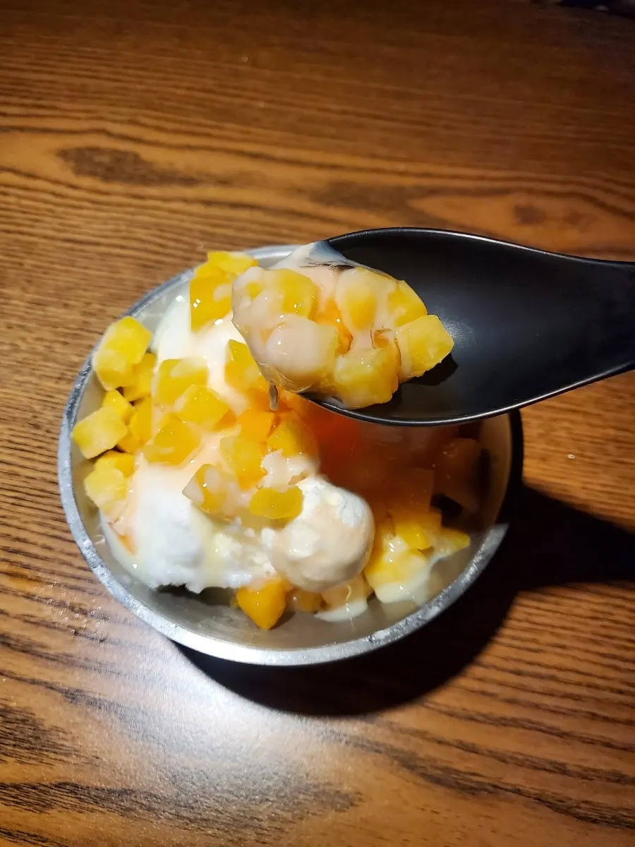 Peach yogurt sherbet dessert served with cheese balls