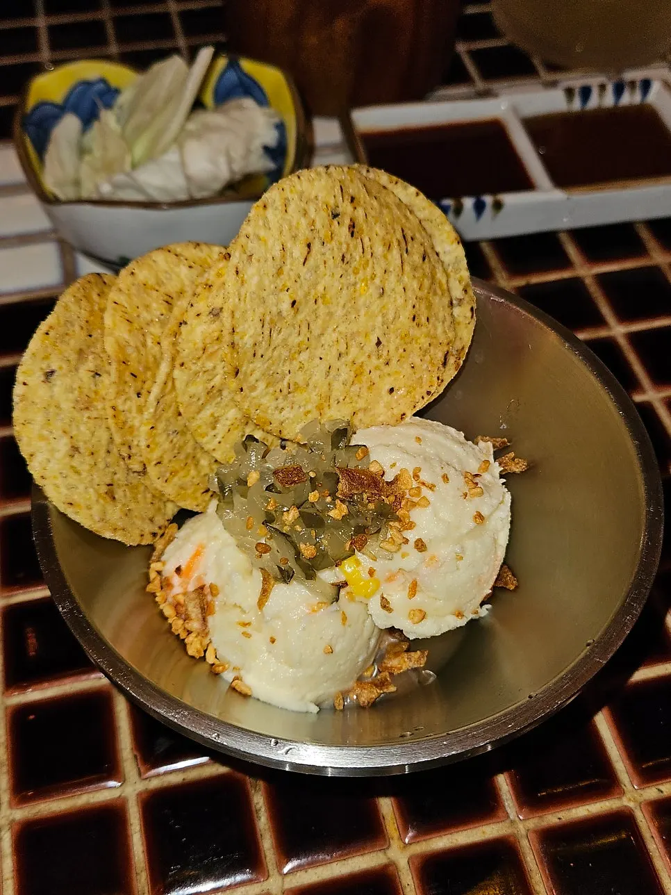 Potato salad and nachos served as an appetizer