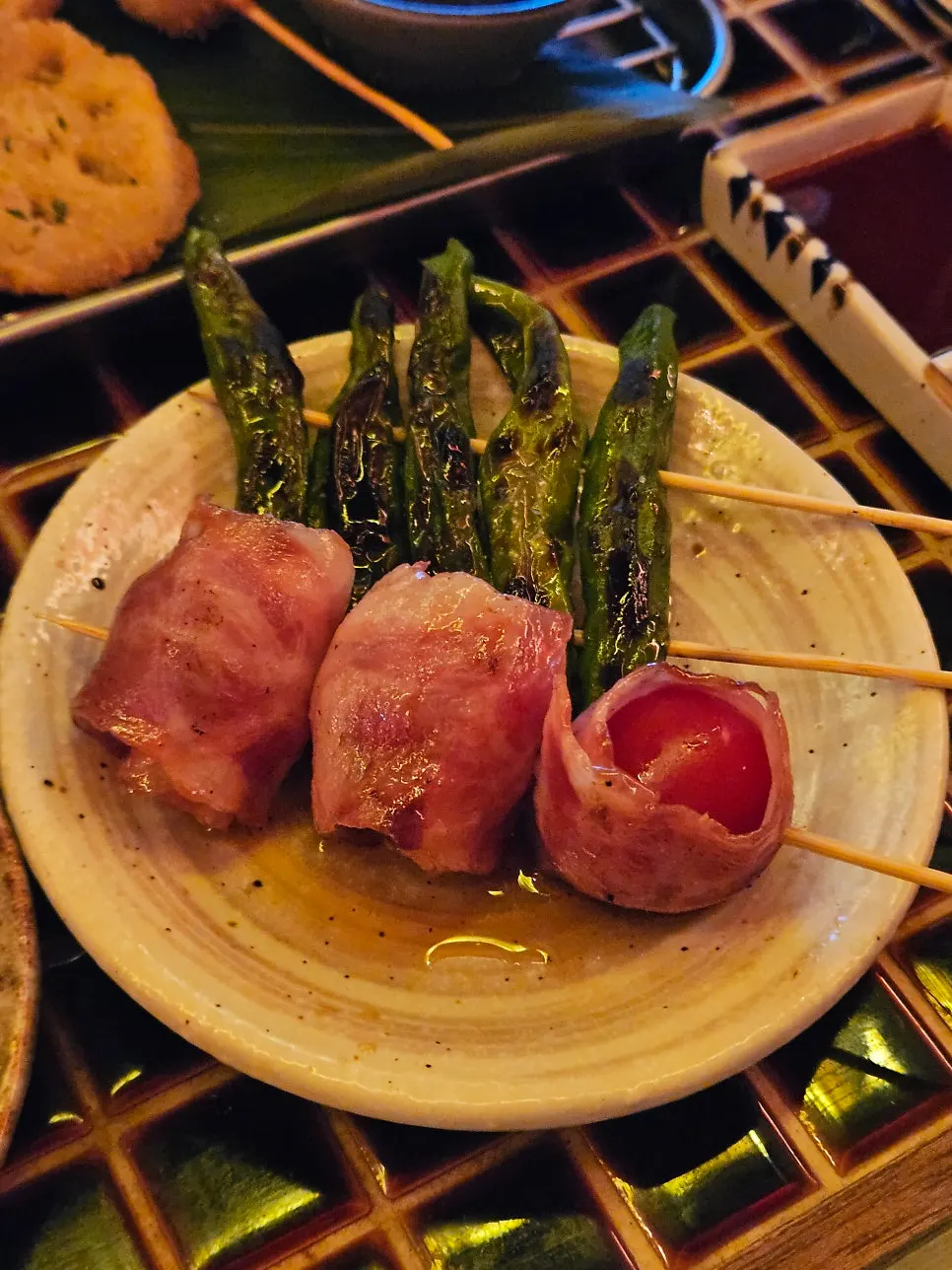 Final skewer of pepper and bacon-wrapped tomato