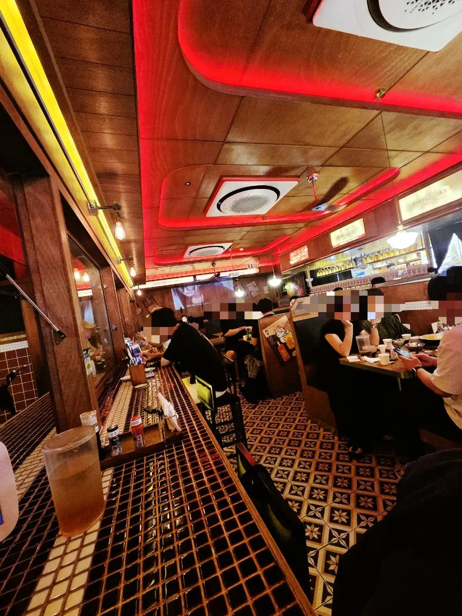 Interior with a retro tile floor and tiled tables