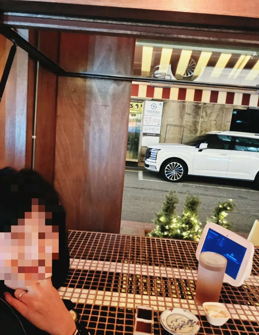 Tiled table at the window seat connecting indoors and outdoors
