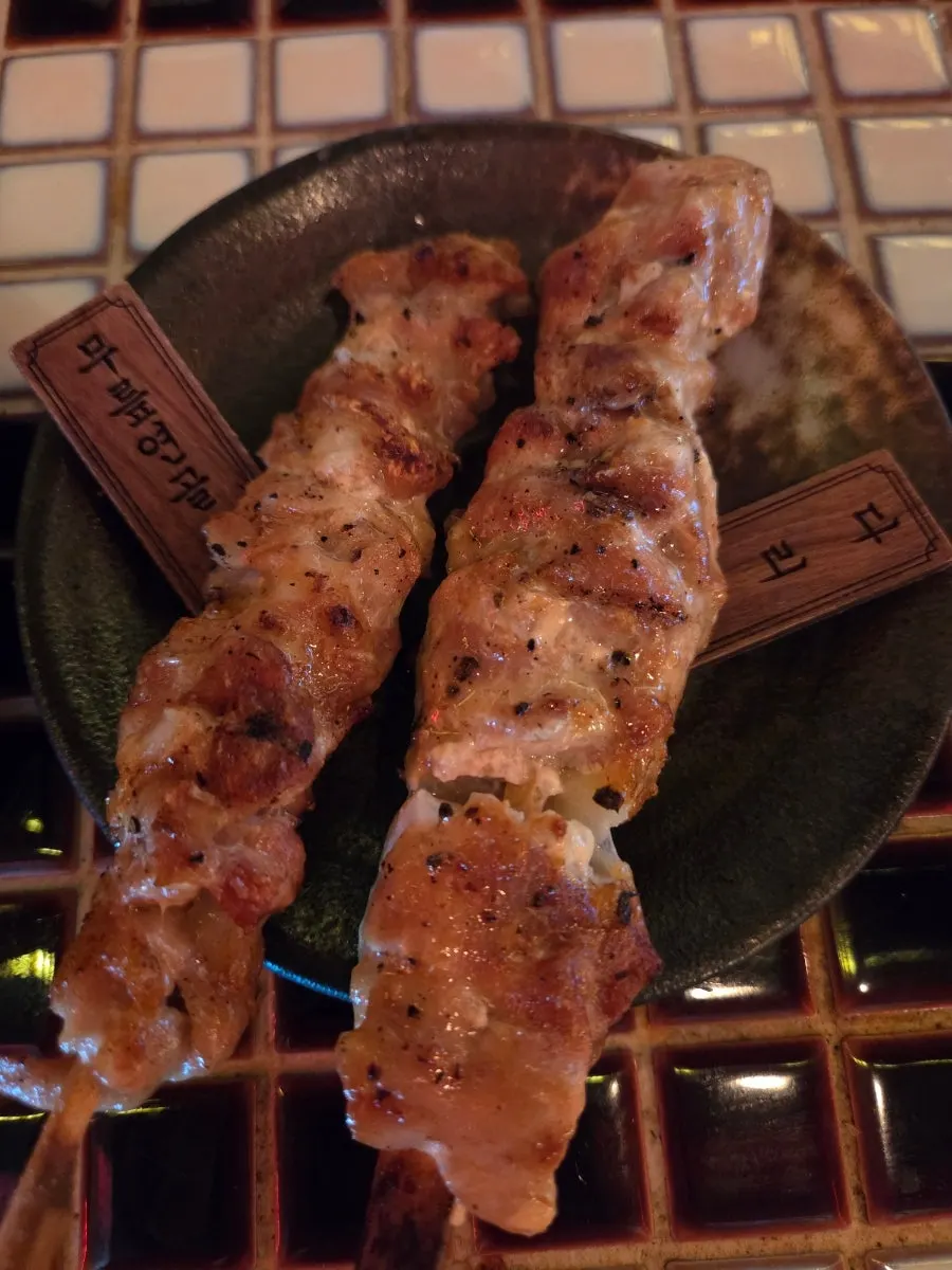 Yakitori skewers with cut name tags attached