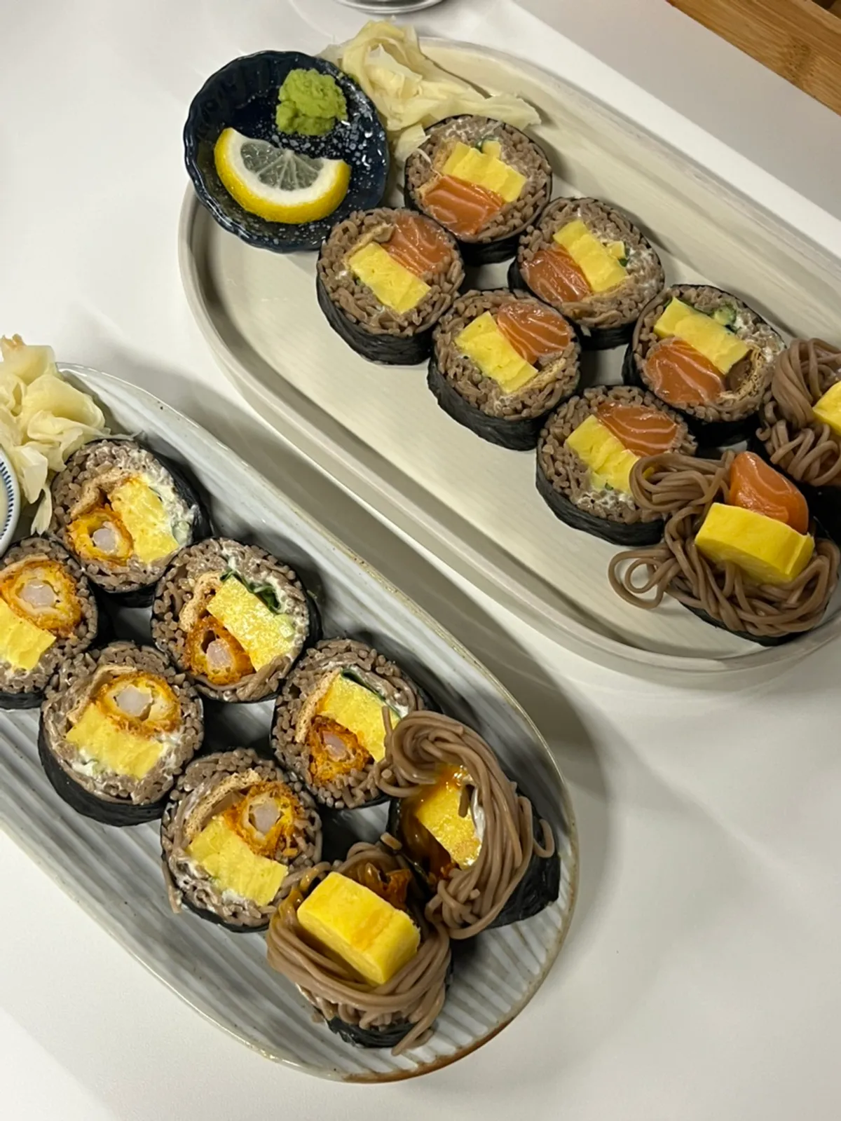 Salmon buckwheat gimbap and shrimp buckwheat gimbap served together