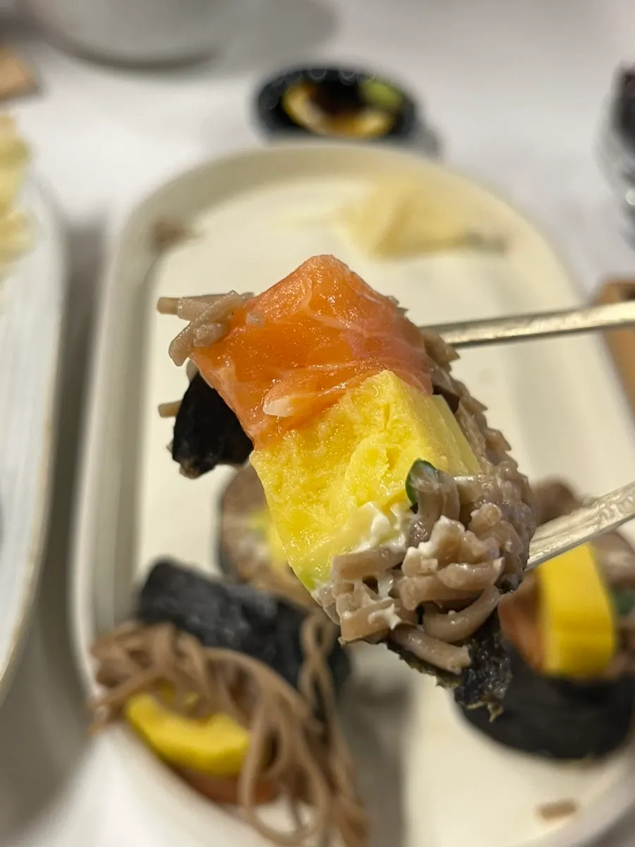 Cross-section of buckwheat gimbap showing salmon and egg