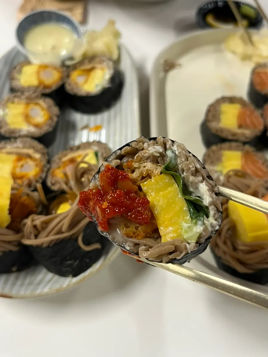Buckwheat gimbap topped with squid jeotgal