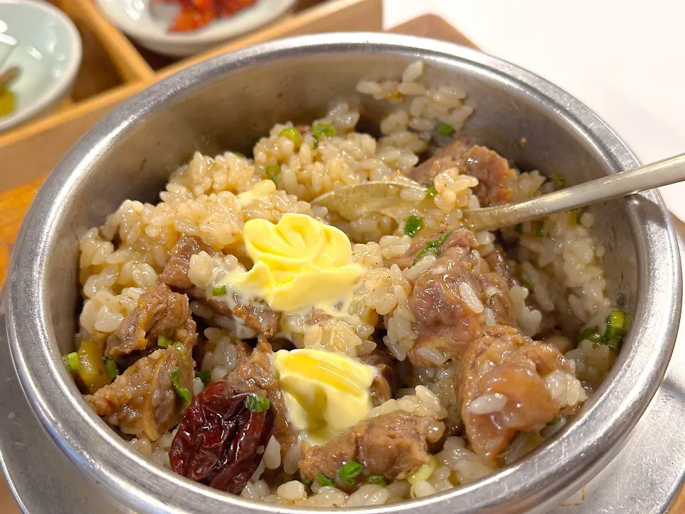 Butter placed on the opened galbi pot rice