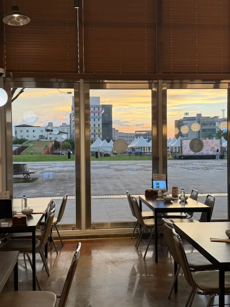Window seat at Sorori Sotbap with evening sunset visible