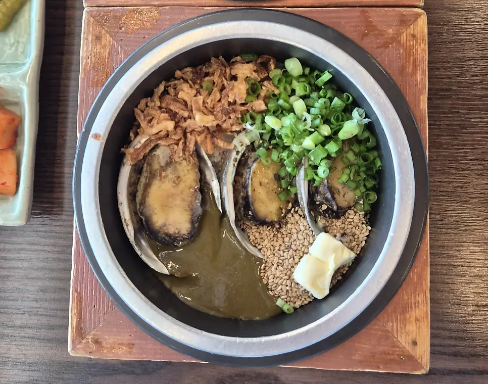 Abalone butter pot rice with geuu sauce made from abalone innards