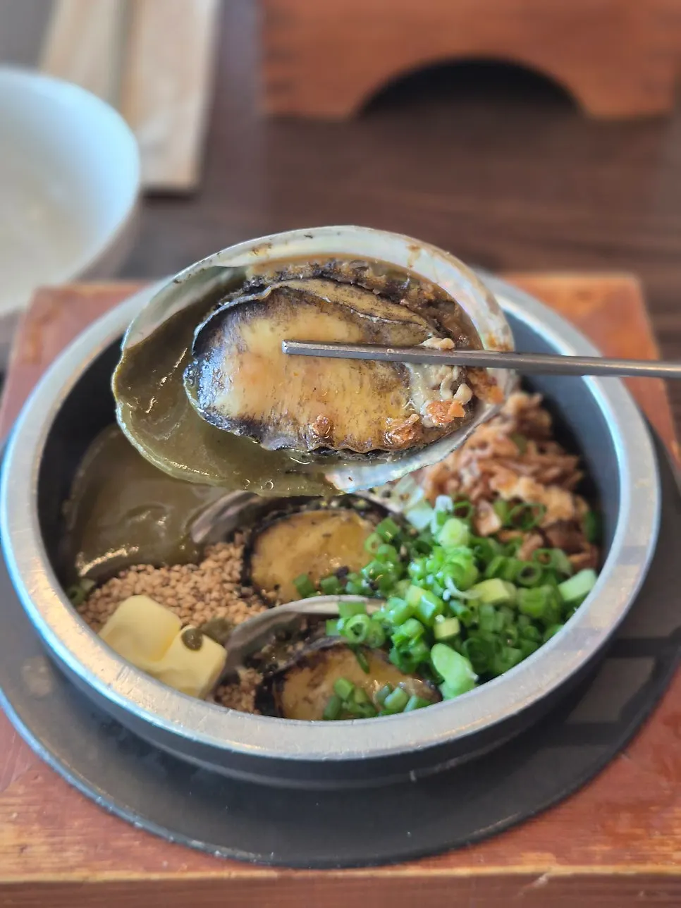 Abalone meat served with its shell on top