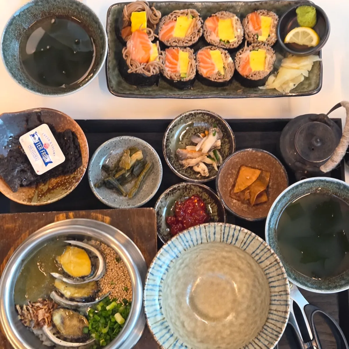 Abalone butter pot rice and raw salmon buckwheat gimbap table setting