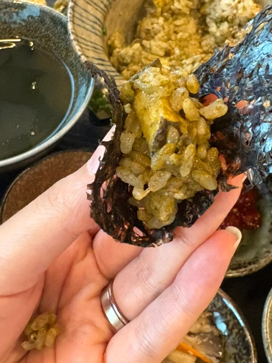 Making scorched rice by pouring water into the emptied pot