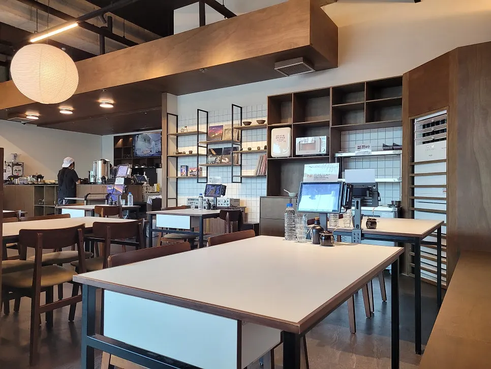 White and wood-toned restaurant interior