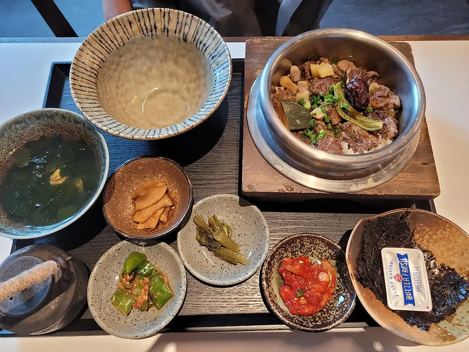 Two pot rice bowls with side dishes