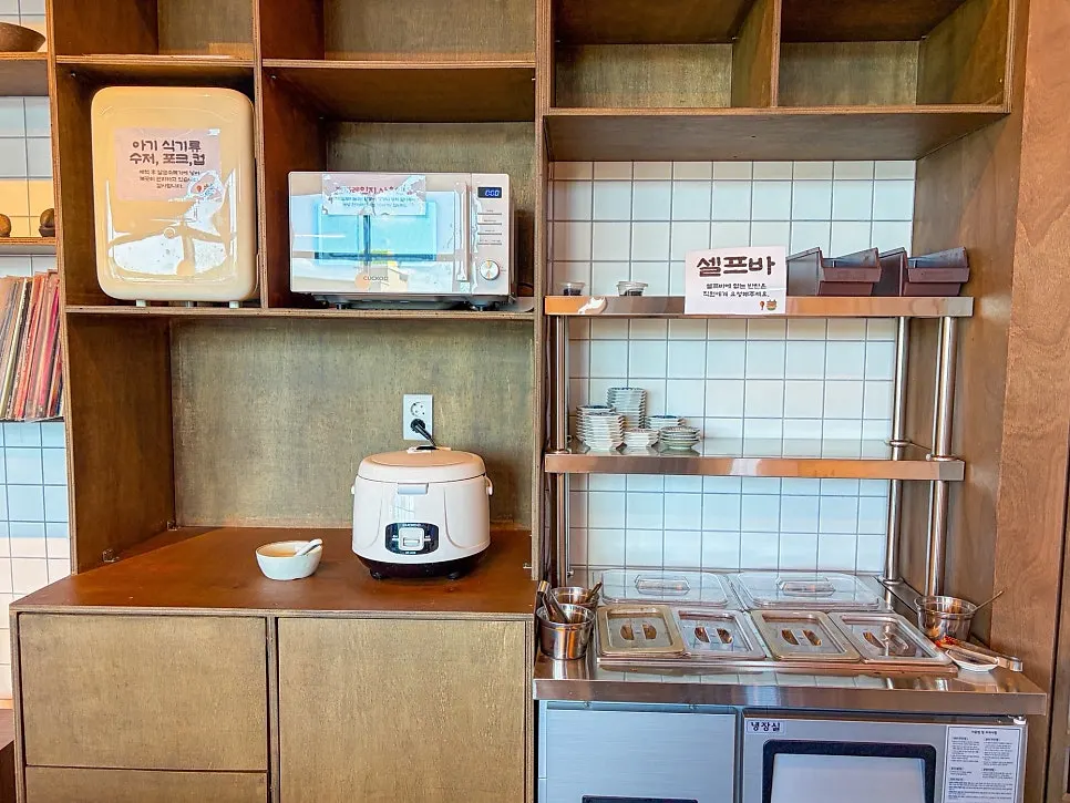 Self-bar with baby dishware and microwave