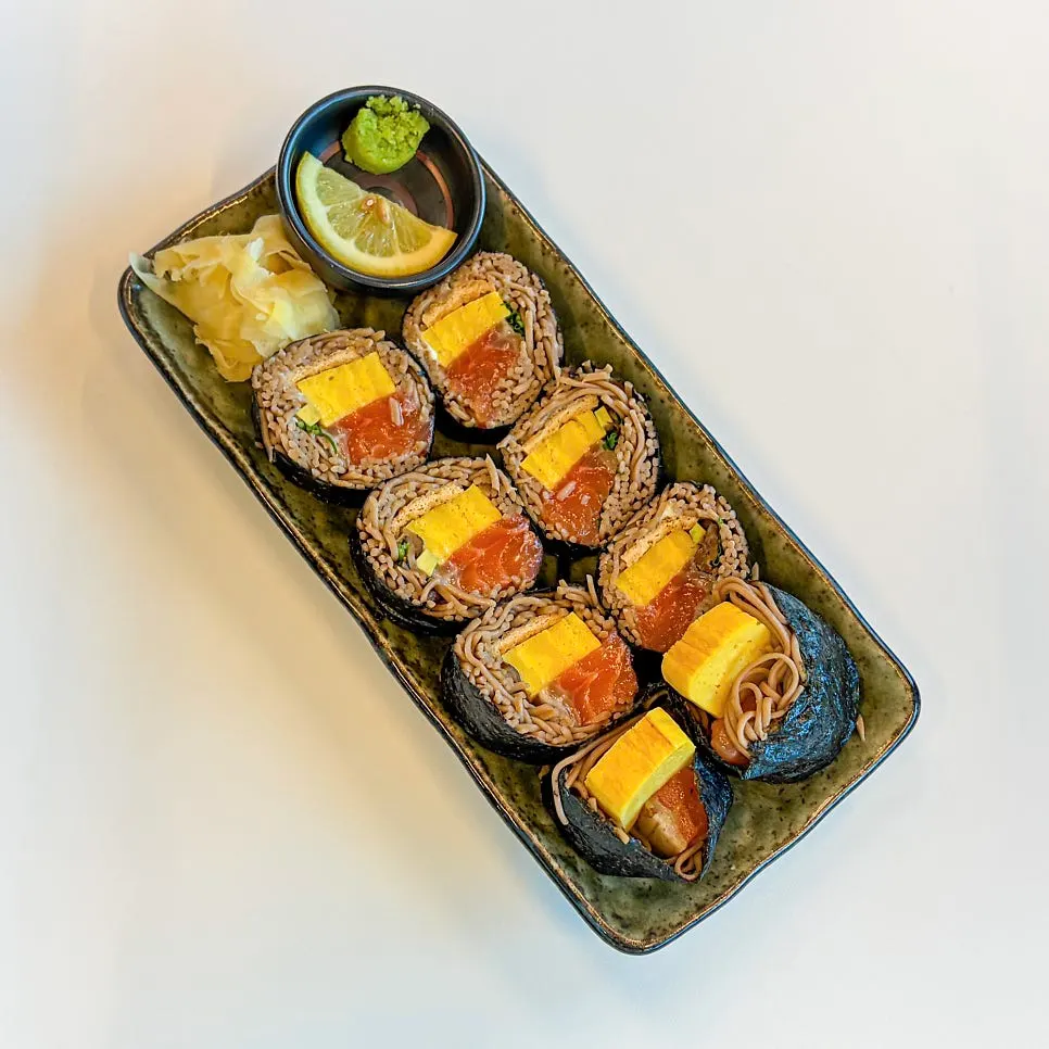 A plate of Sorori Sotbap's raw salmon buckwheat gimbap