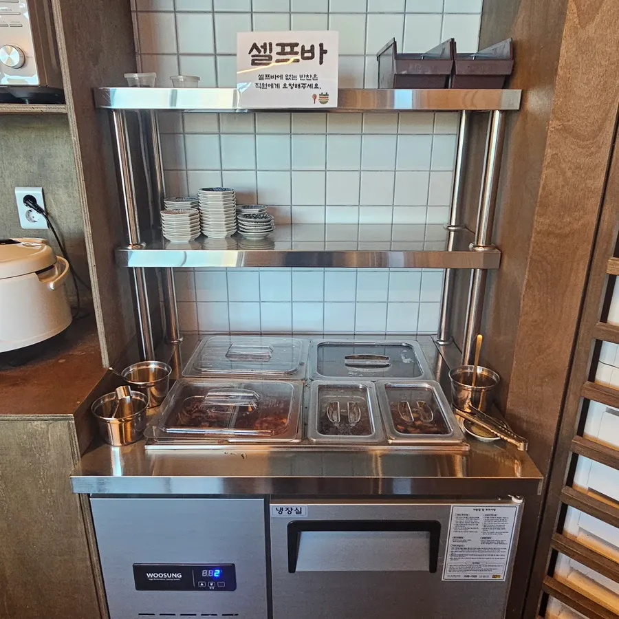 Self-serve bar where diners help themselves to side dishes