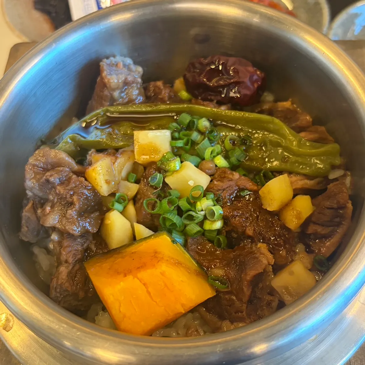 Beef rib pot rice topped with sweet pumpkin
