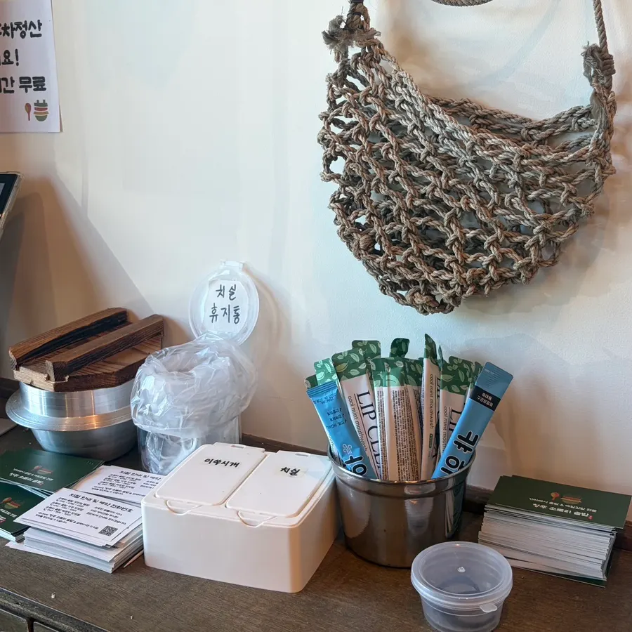 Toothpicks, dental floss, and mouthwash set out at the exit