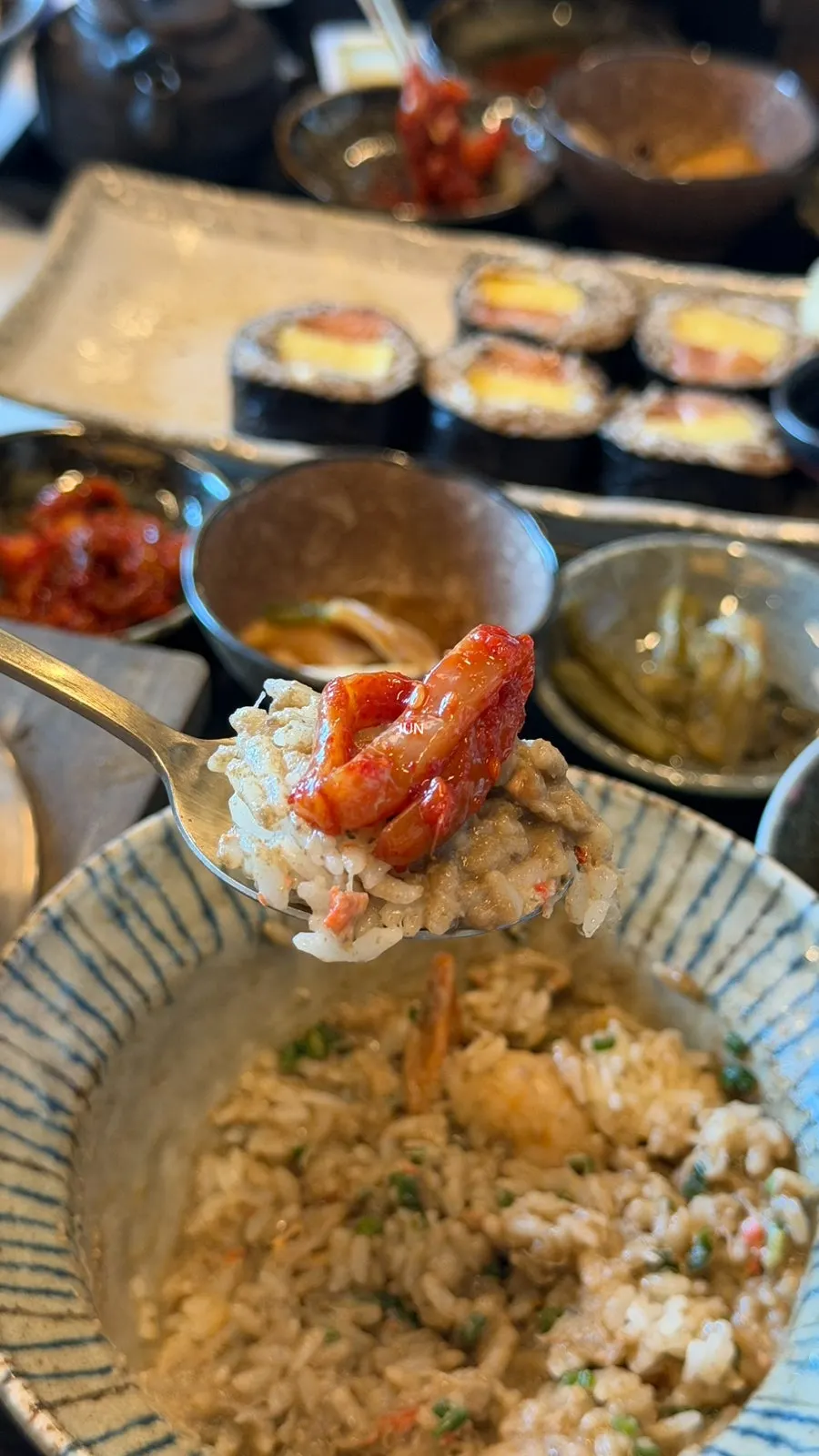 A spoonful of mixed crab pot rice