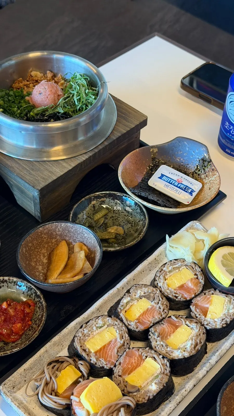 A spoonful of mentaiko butter pot rice with seaweed soup