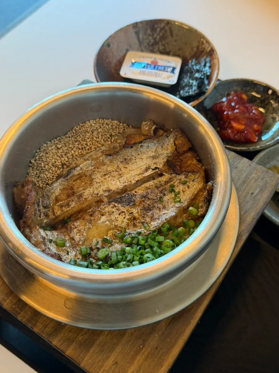 Pot rice table setting with clam seaweed soup and side dishes