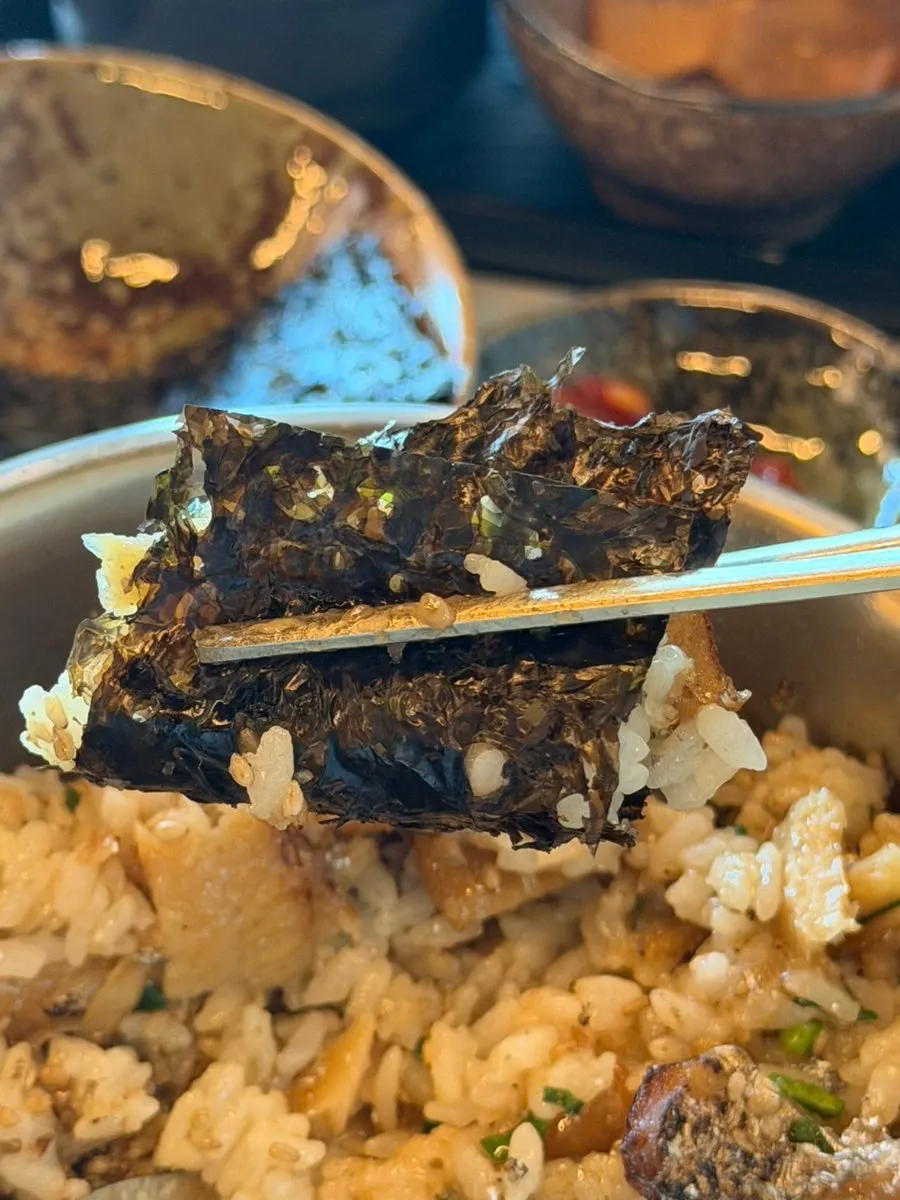 Seasoned squid placed on top of pot rice
