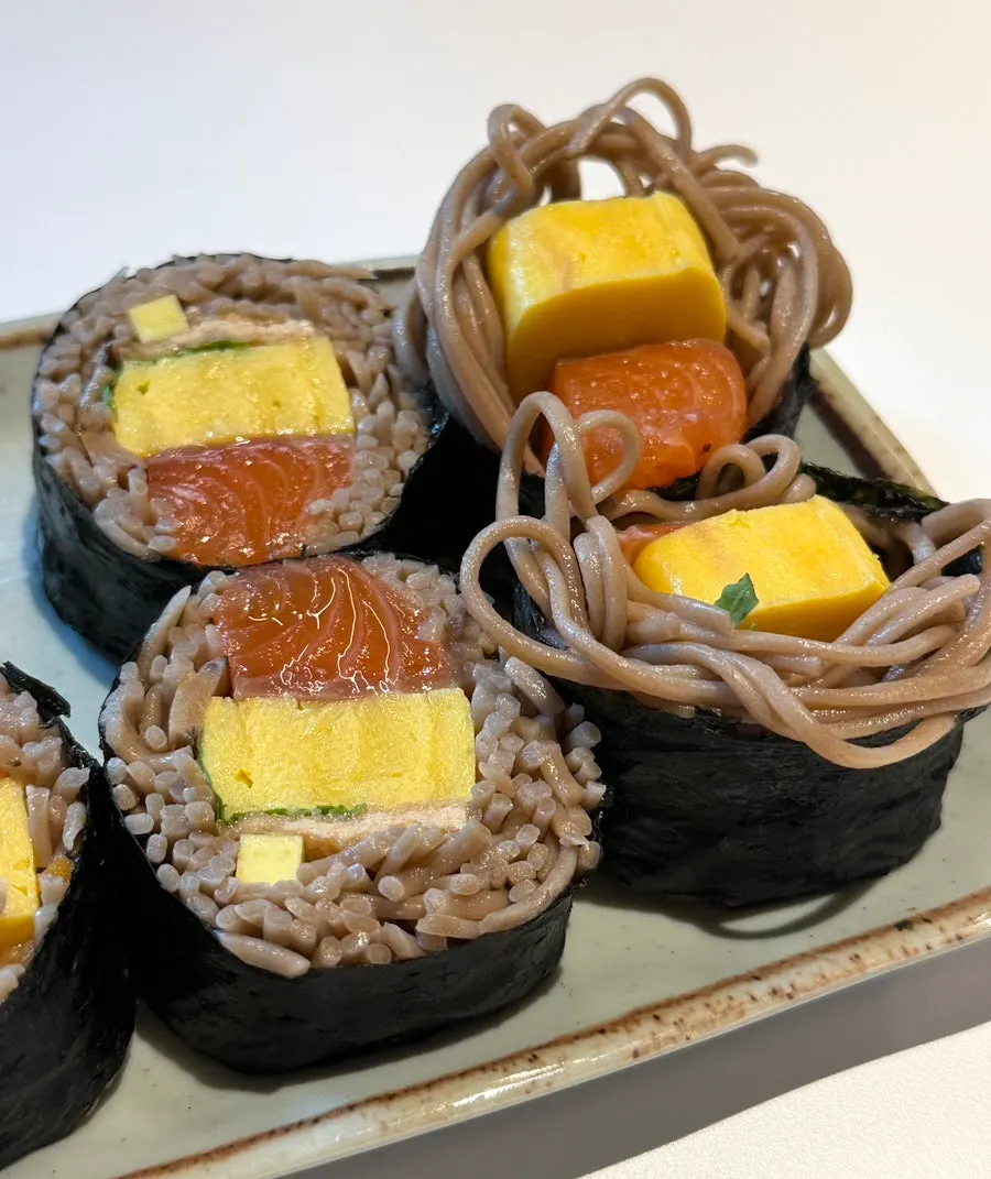 Cross-section of gimbap with buckwheat noodles and raw salmon
