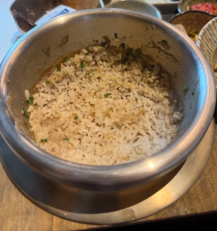 Pot rice mixed and transferred into a rice bowl