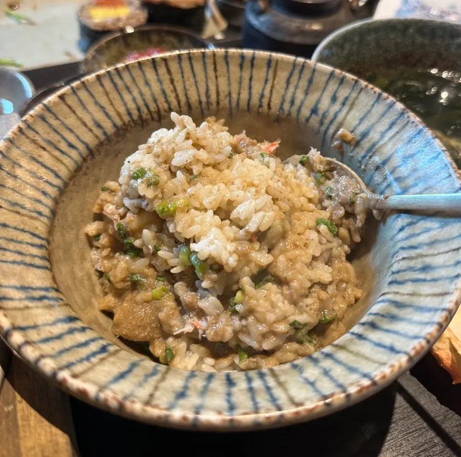 Pot rice table setting with soy sauce, butter, furikake, and seaweed