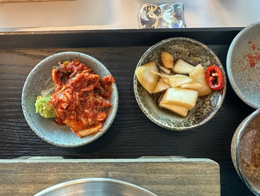 Refilled kimchi and pickled onion from the self-serve bar