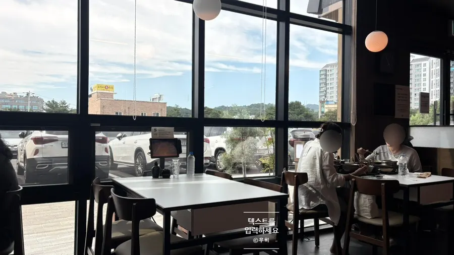 Interior of the restaurant with a kiosk at every table
