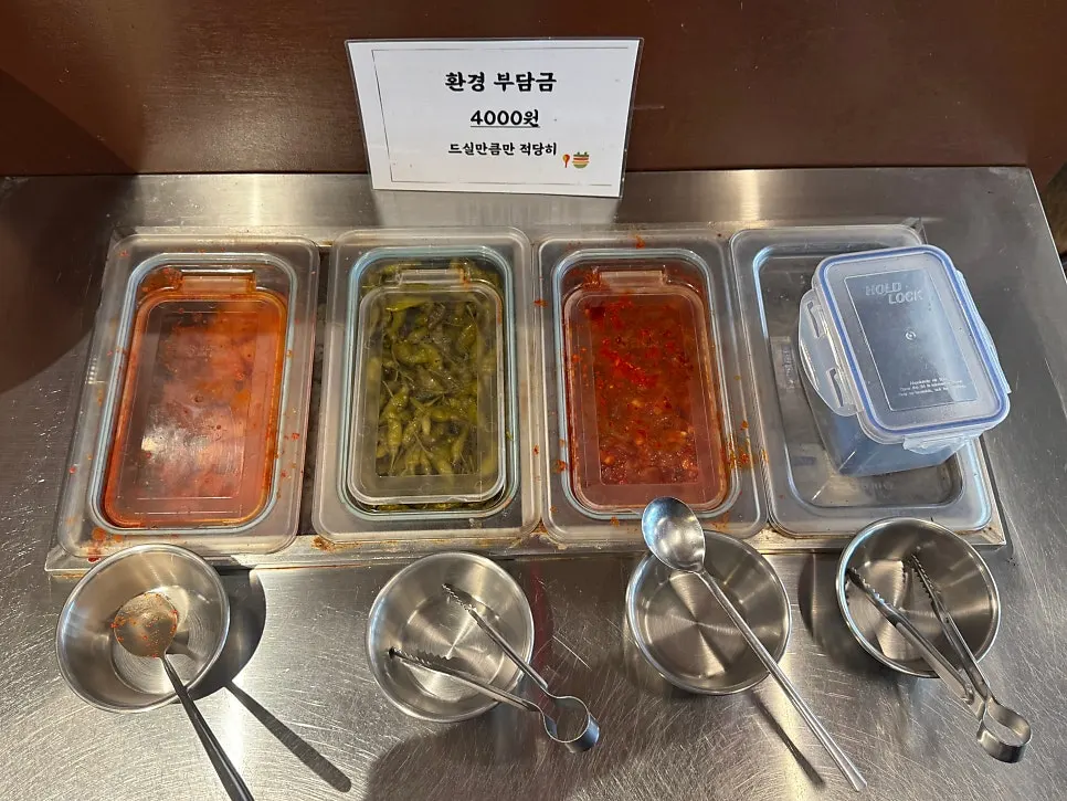 Basic side dishes including diced radish kimchi and salted squid