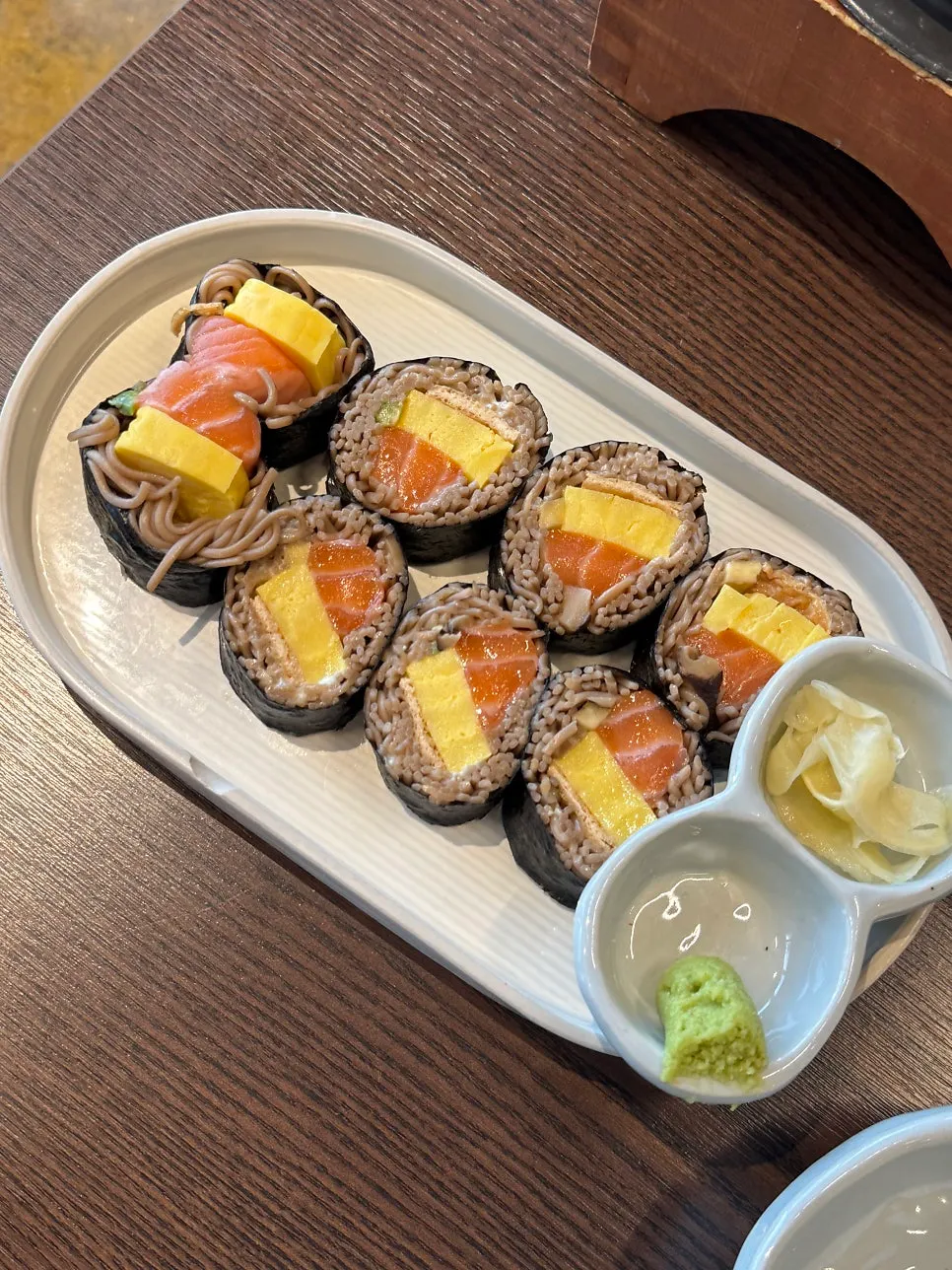 Table set with short rib pot rice and fresh salmon soba gimbap