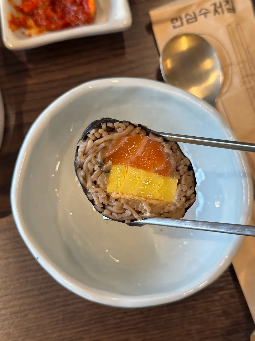 A plate of fresh salmon soba gimbap