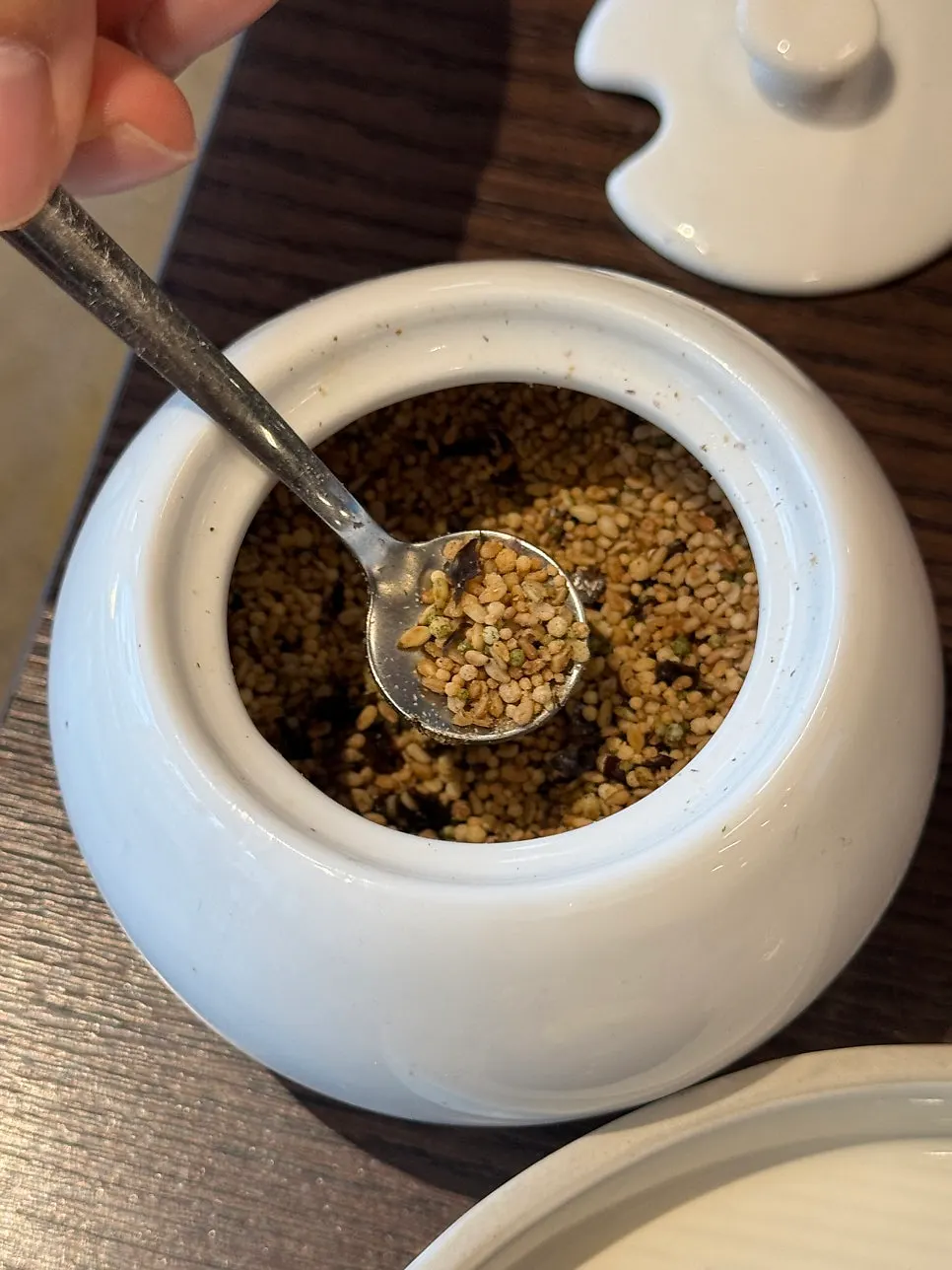 A spoonful of pot rice topped with tender short rib