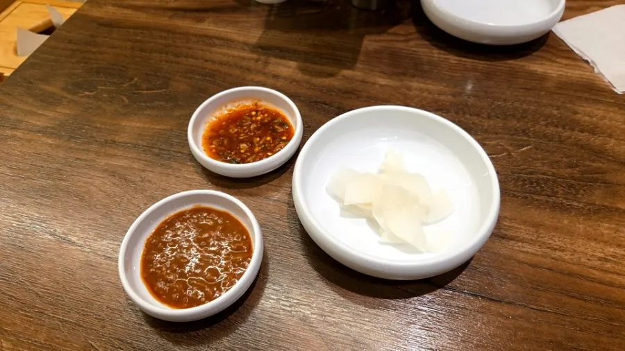 Warm, rich broth served at the table