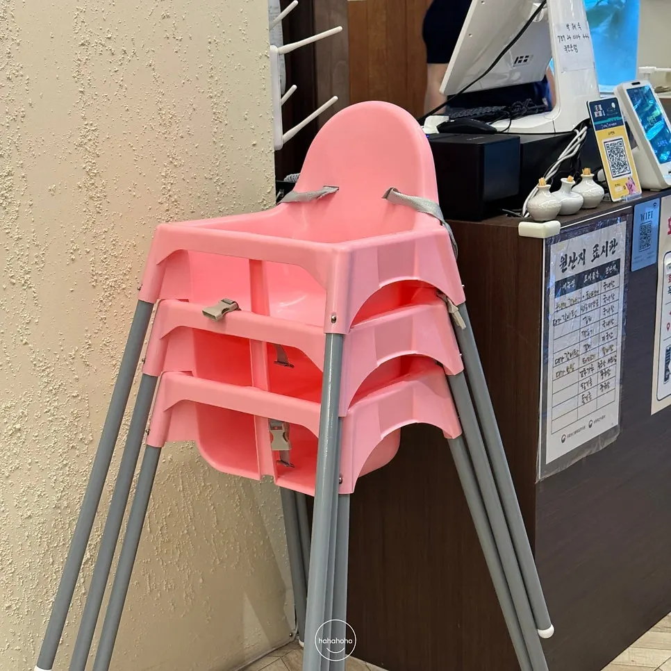 Standing coat rack along the restaurant wall