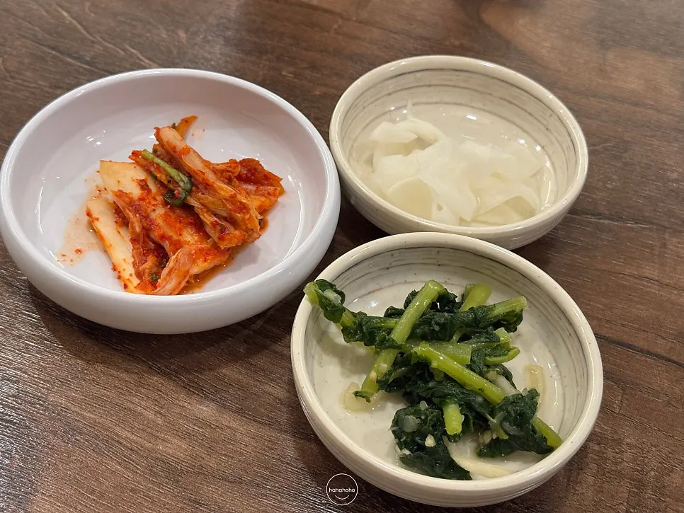Napa cabbage kimchi, pickled radish, and yeolmu kimchi taken from the self-serve bar