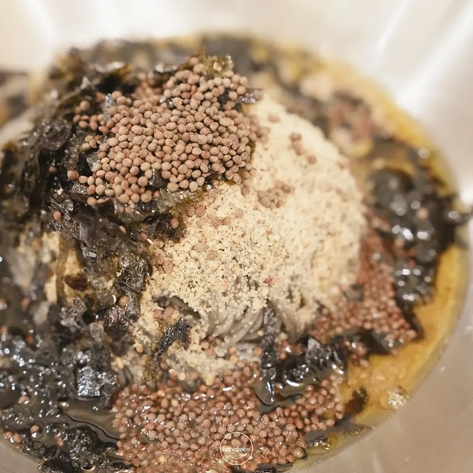 Close-up of the squid-ink noodles in the perilla-oil Hamhung noodles