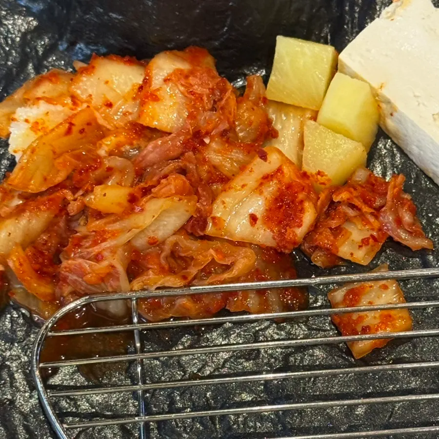 Kimchi side dish tossed in pork belly fat