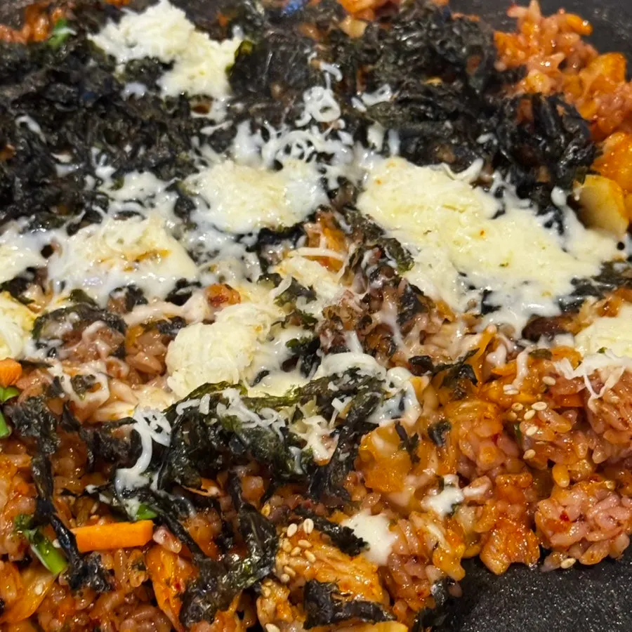 Close-up of melted cheese over kimchi fried rice