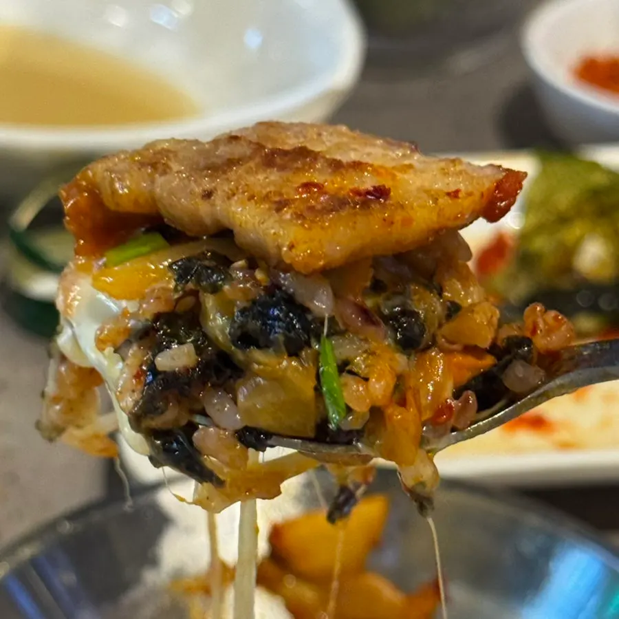 A spoonful of cheese kimchi fried rice
