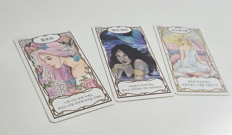 Forty goddess oracle cards spread out