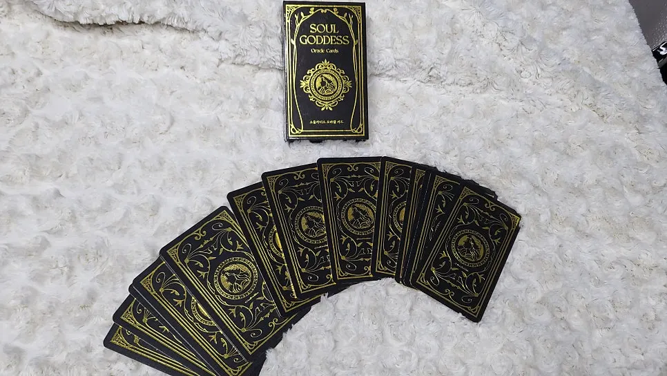 Gold-colored sides of oracle cards