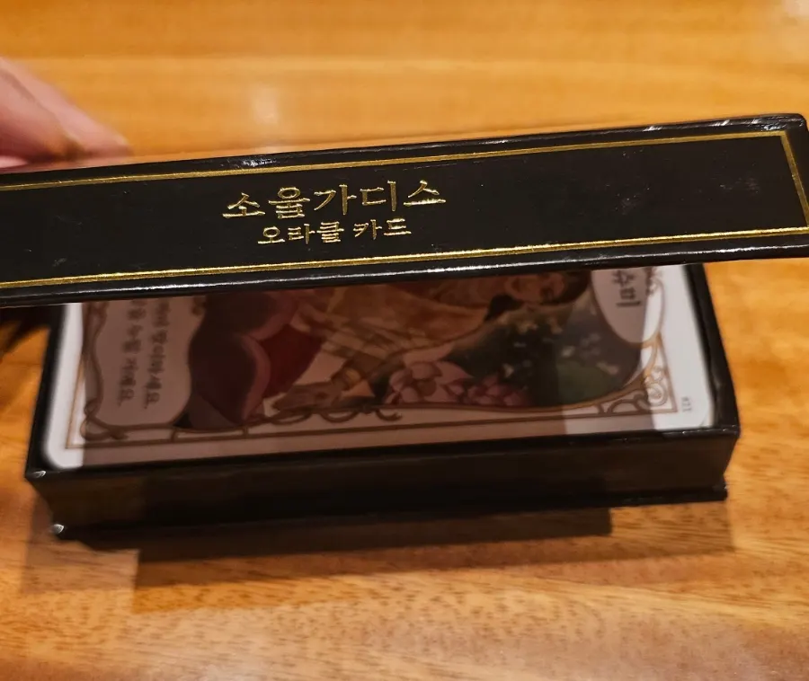 Gilded oracle cards with the plastic removed