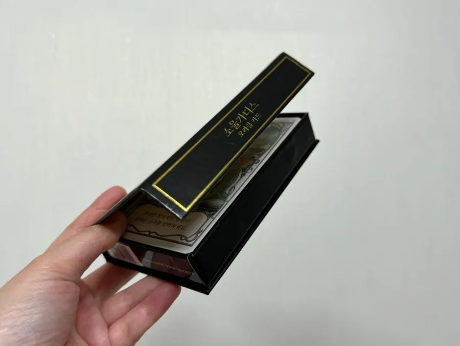 Black and gold card packaging