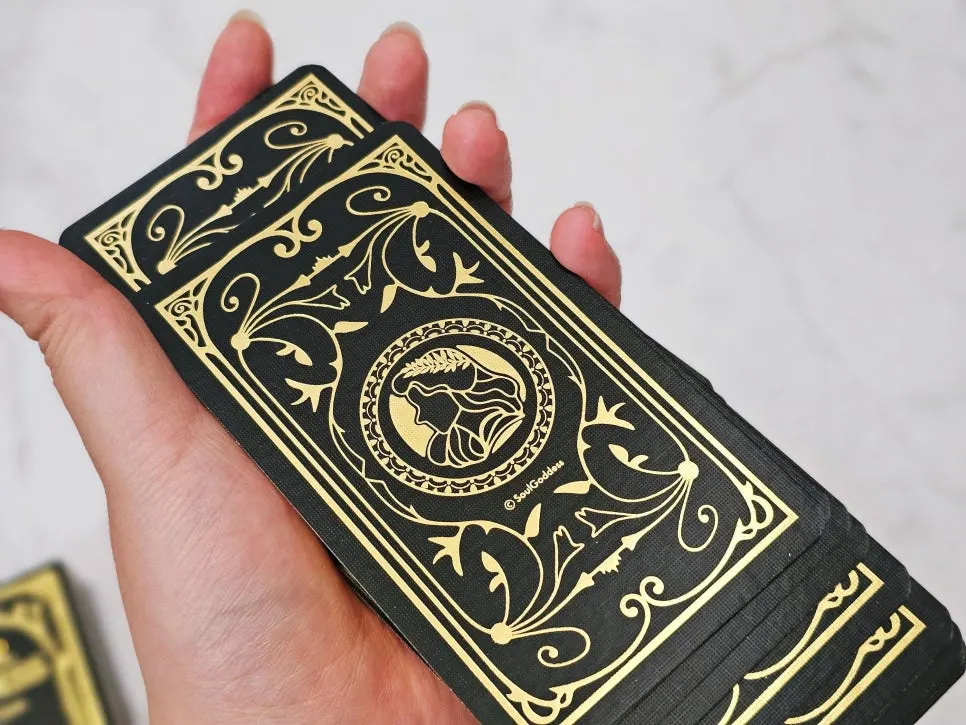 Gold-foil backs and edges of the oracle cards