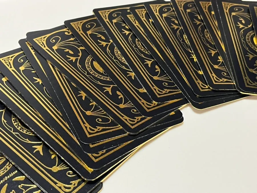 Black-and-gold oracle card design