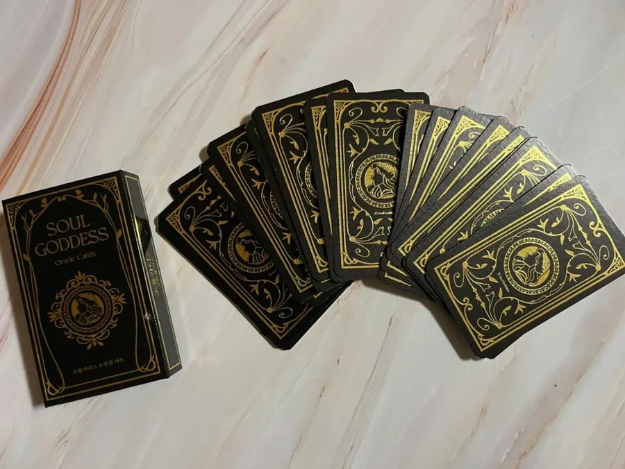 Thick oracle cards with gold-colored edges